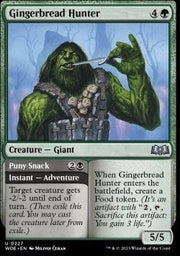 Gingerbread Hunter // Puny Snack⁣ - Wilds of Eldraine⁣ (Uncommon)⁣ [227] - El Duelista